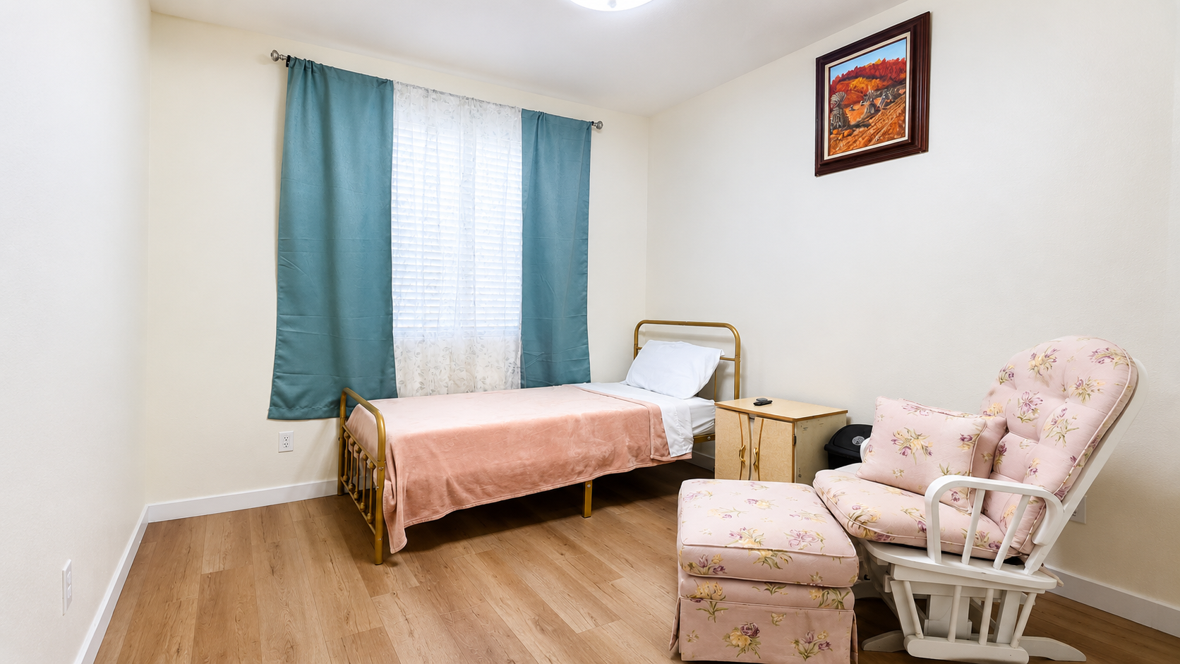 Private bedroom with a comfortable bed, floral chair, and soft natural light